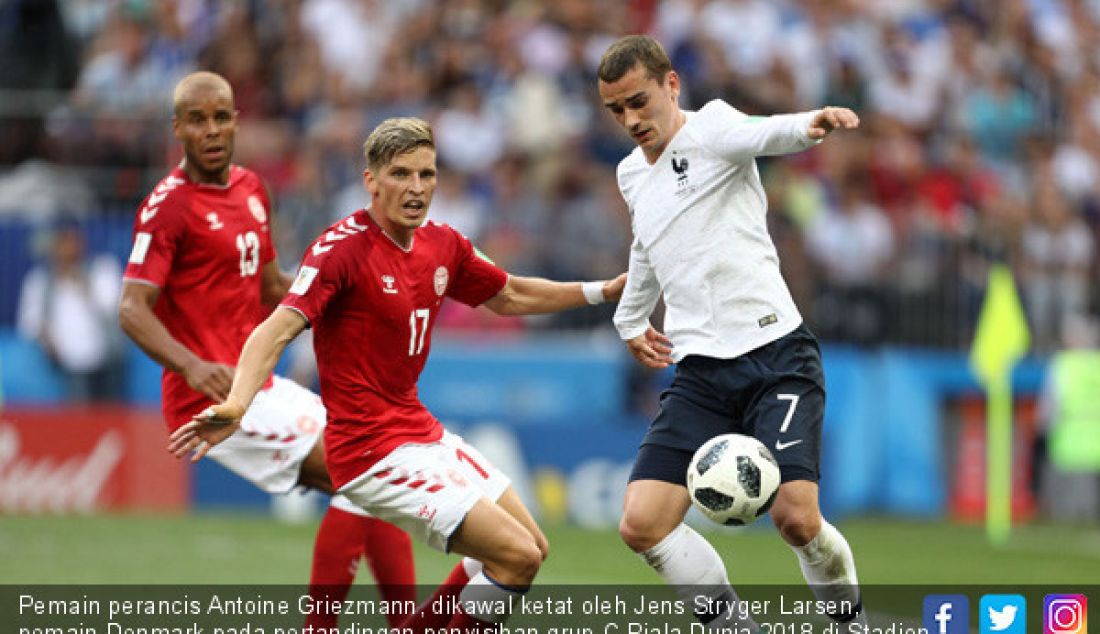 Pemain perancis Antoine Griezmann, dikawal ketat oleh Jens Stryger Larsen, pemain Denmark pada pertandingan penyisihan grup C Piala Dunia 2018 di Stadion Luzhniki, Rusia, Selasa (26/6). - JPNN.com