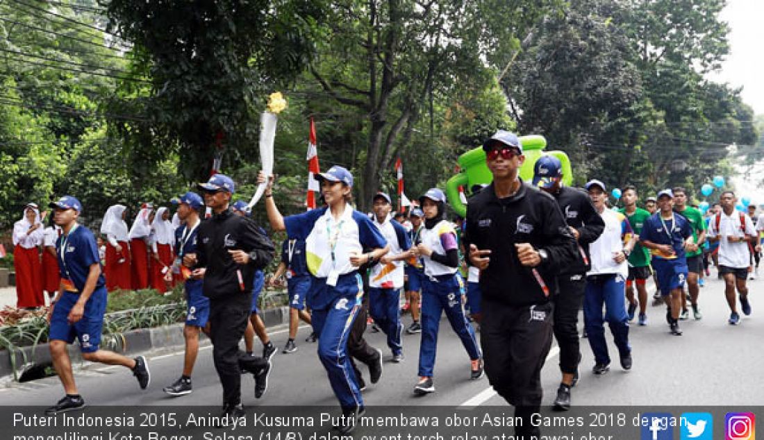 Puteri Indonesia 2015, Anindya Kusuma Putri membawa obor Asian Games 2018 dengan mengelilingi Kota Bogor, Selasa (14/8) dalam event torch relay atau pawai obor. - JPNN.com