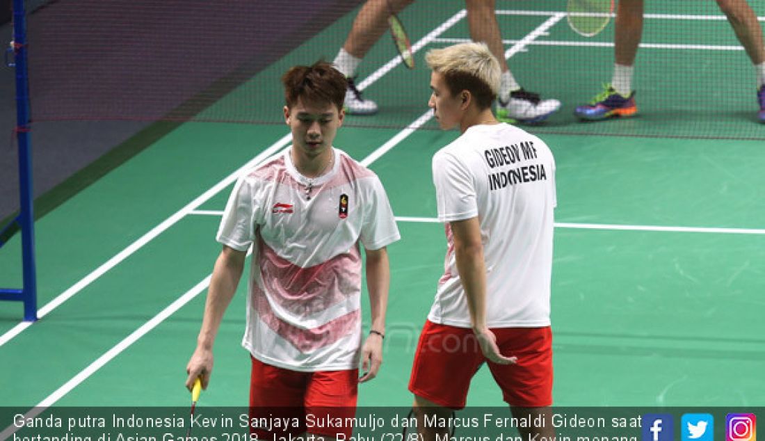 Ganda putra Indonesia Kevin Sanjaya Sukamuljo dan Marcus Fernaldi Gideon saat bertanding di Asian Games 2018, Jakarta, Rabu (22/8). Marcus dan Kevin menang atas ganda putra China dengan dua set langsung. - JPNN.com