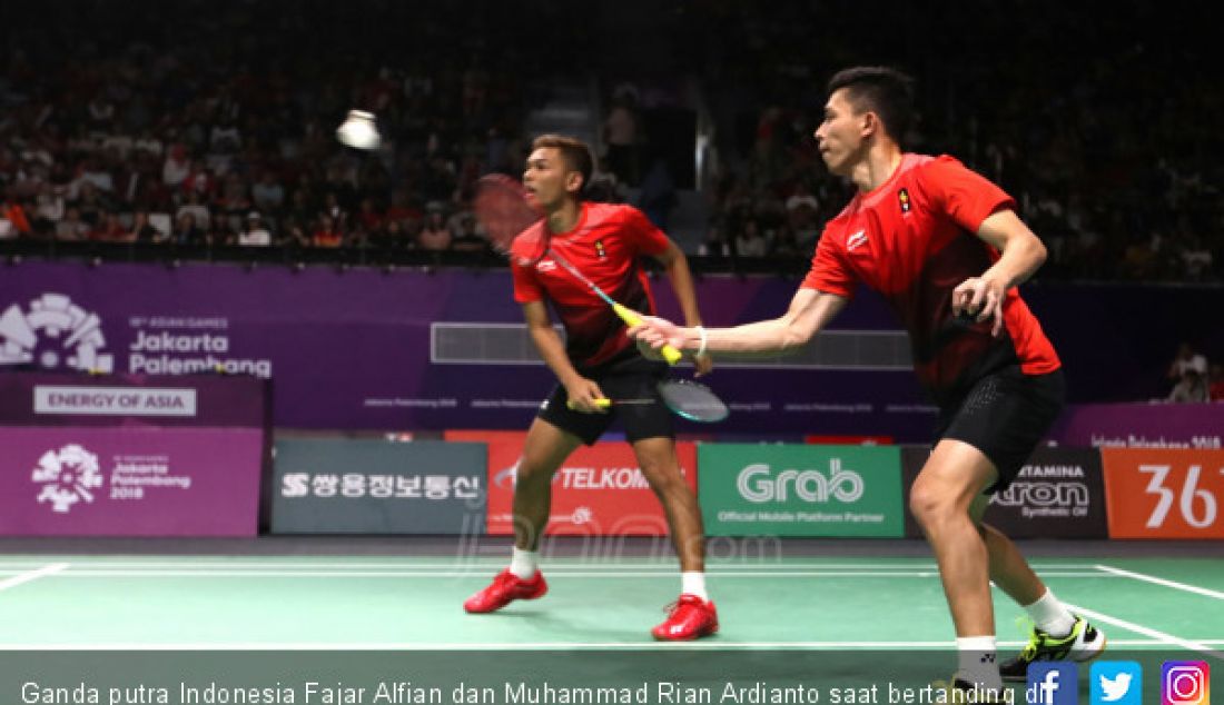 Ganda putra Indonesia Fajar Alfian dan Muhammad Rian Ardianto saat bertanding di Asian Games 2018, Jakarta, Minggu (26/8). - JPNN.com