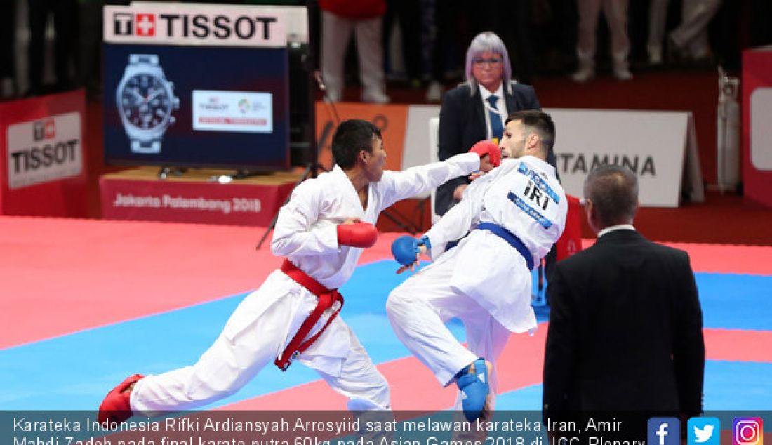 Karateka Indonesia Rifki Ardiansyah Arrosyiid saat melawan karateka Iran, Amir Mahdi Zadeh pada final karate putra 60kg pada Asian Games 2018 di JCC-Plenary Hall Senayan, Jakarta, Sabtu (25/8). - JPNN.com