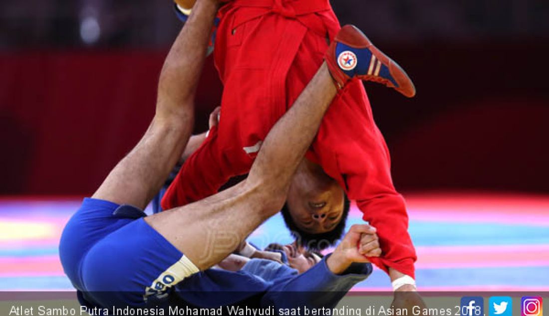 Atlet Sambo Putra Indonesia Mohamad Wahyudi saat bertanding di Asian Games 2018, Jakarta, Jumat (31/8). - JPNN.com