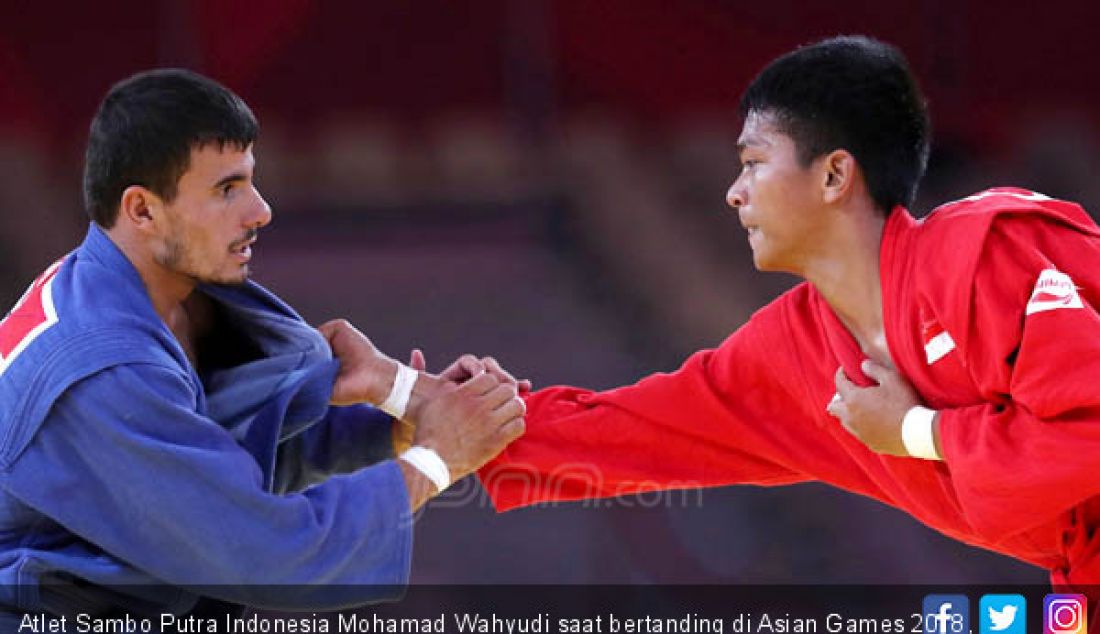 Atlet Sambo Putra Indonesia Mohamad Wahyudi saat bertanding di Asian Games 2018, Jakarta, Jumat (31/8). - JPNN.com