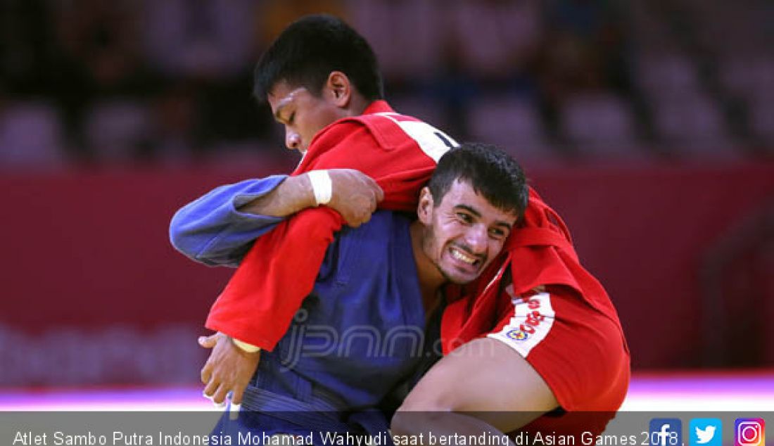 Atlet Sambo Putra Indonesia Mohamad Wahyudi saat bertanding di Asian Games 2018, Jakarta, Jumat (31/8). - JPNN.com