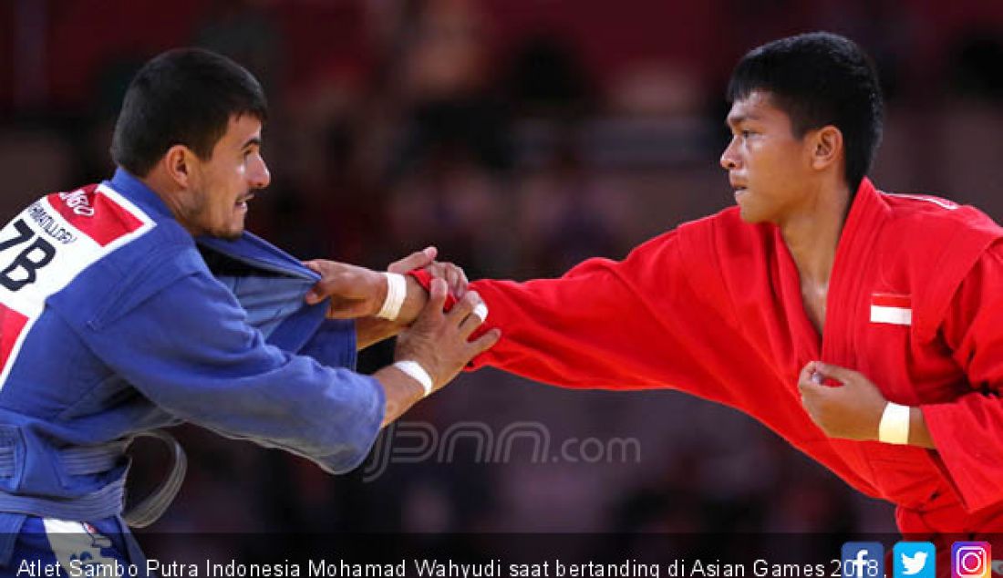 Atlet Sambo Putra Indonesia Mohamad Wahyudi saat bertanding di Asian Games 2018, Jakarta, Jumat (31/8). - JPNN.com