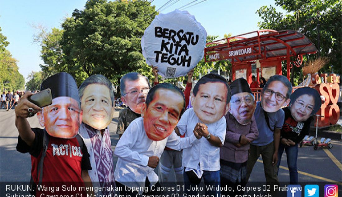 RUKUN: Warga Solo mengenakan topeng Capres 01 Joko Widodo, Capres 02 Prabowo Subianto, Cawapres 01 Ma'aruf Amin, Cawapres 02 Sandiaga Uno, serta tokoh nasional saat aksi damai di kawasan CFD Slamet Riyadi, Minggu (26/5). - JPNN.com