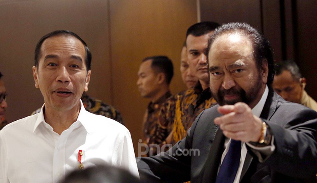 Presiden Joko Widodo dan Ketum Partai Nasdem Surya Paloh pada peringatan HUT ke-8 Partai Nasdem, Jakarta, Senin (11/11). - JPNN.com