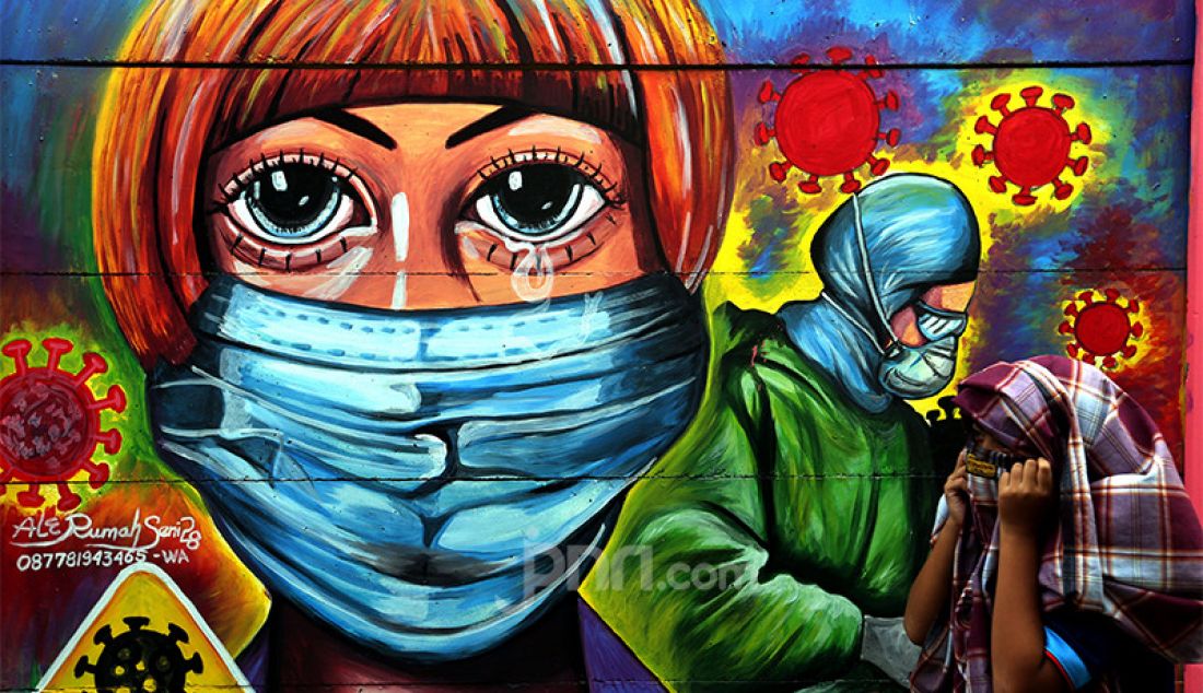 Mural bertema Covid-19 di kawasan Tanah Tinggi, Tangerang, Banten, Rabu (20/1) guna mengingatkan masyarakat akan bahaya penyakit akibat virus corona jenis baru tersebut. - JPNN.com