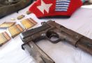 Di dalam Karung Berisi Beras Ditemukan Satu Senjata Api Milik TNI - JPNN.com