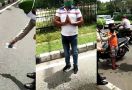 Meludah Sembarangan, Pemotor Ini Disuruh Bersihkan Jalan - JPNN.com