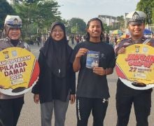 Cara Unik Satlantas Polresta Pekanbaru Sosialisasi Pilkada Damai di CFD - JPNN.com