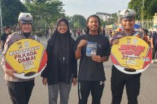 Cara Unik Satlantas Polresta Pekanbaru Sosialisasi Pilkada Damai di CFD - JPNN.com