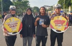 Cara Unik Satlantas Polresta Pekanbaru Sosialisasi Pilkada Damai di CFD - JPNN.com