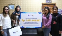 AXA Mandiri Bayarkan Klaim Asuransi Rp 1,073 Miliar - JPNN.com