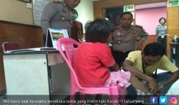 Polisi Tetapkan Orang Tua Perantai Anak Itu jadi Tersangka - JPNN.com