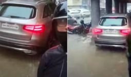 Jangan Dicontoh! Sopir Mobil Mewah Ambil Jalur Pejalan Kaki, Takut Kena Banjir - JPNN.com