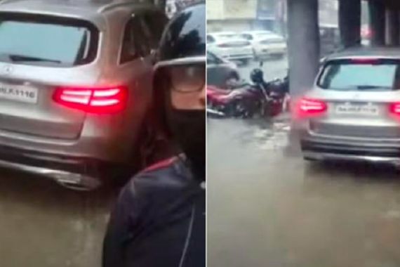 Jangan Dicontoh! Sopir Mobil Mewah Ambil Jalur Pejalan Kaki, Takut Kena Banjir - JPNN.COM